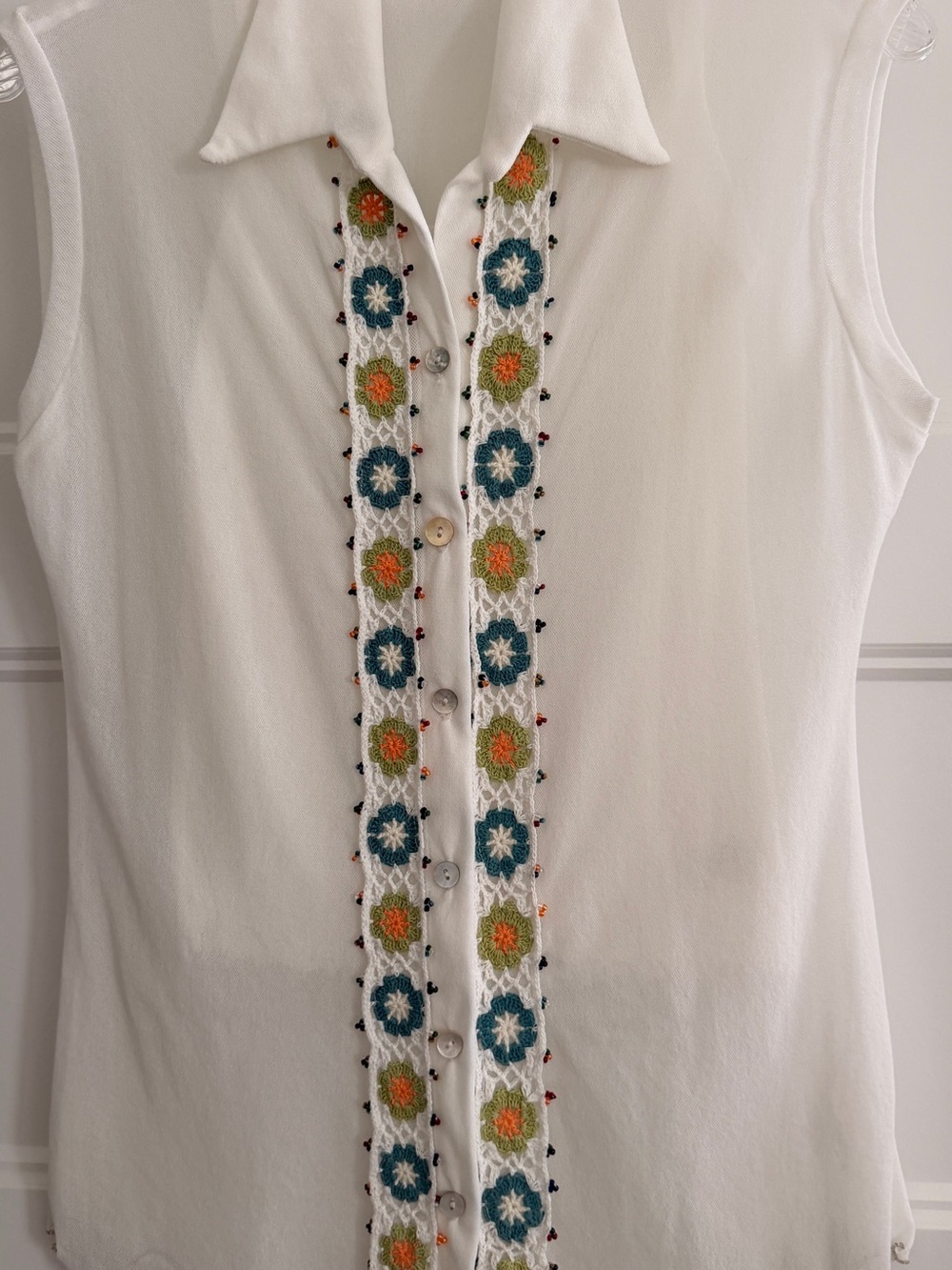 White Sleeveless Button-Front Top with Floral Embroidered Trim